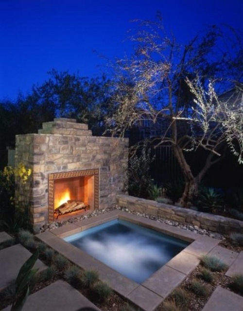 outdoor jacuzzi square water edge stone fire fireplace