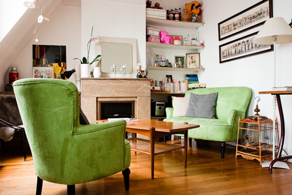 Green sofas in the vintage living room