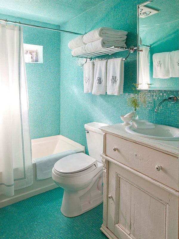 Bathroom small tub light blue tile