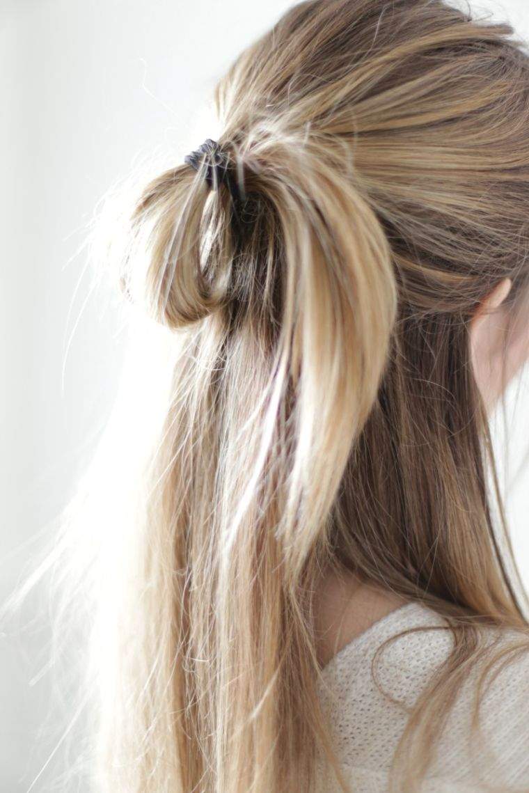 shaded sweeping blonde hair hairstyle bun casual