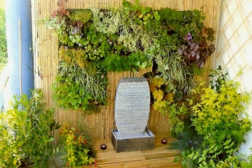 balkongvägg vegetal fontän stenplanter grönska bambu