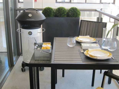 Electric barbecue black white balcony