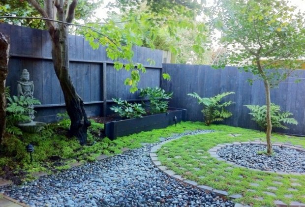 beautiful zen garden with buddha statue