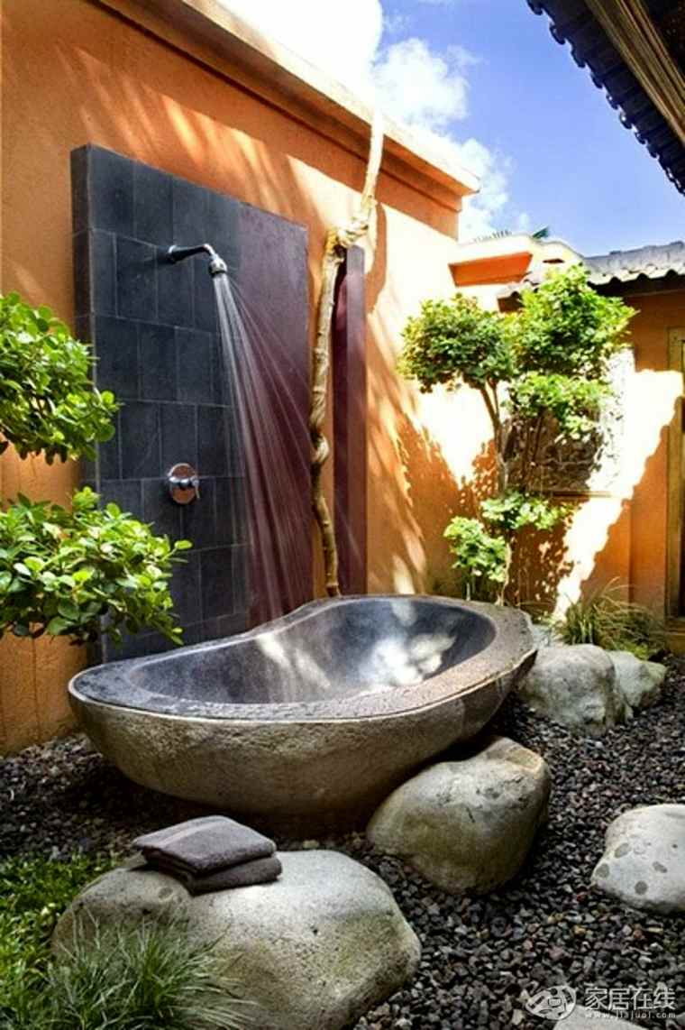 beautiful rustic stone bathtub