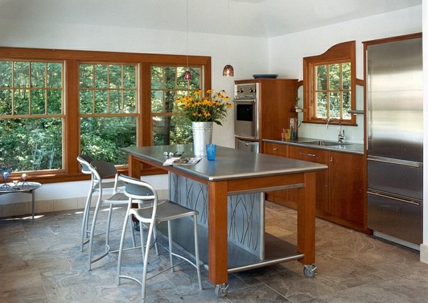 beautiful kitchen with removable central island that serves as a bar