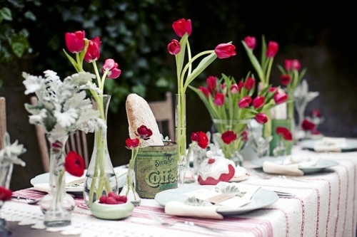 beautiful table decorated red tulips