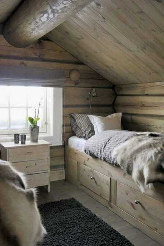 Chalet style bedroom storage under the wooden bed
