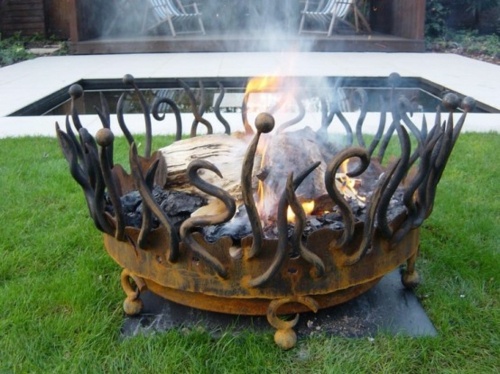 brazier iron forge openwork pool rust fire grass lawn