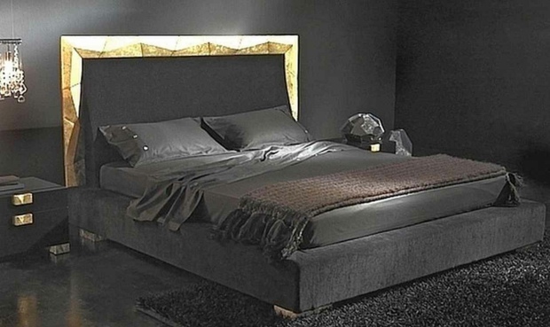 bedroom decorated in black golden headboard