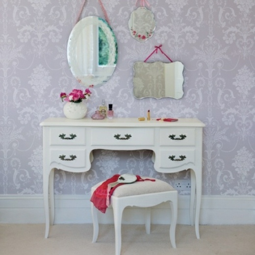 simple dressing table with mirrors on the wall