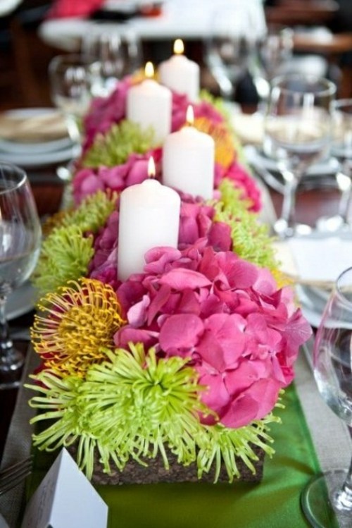 floral composition centerpiece decorated with candles