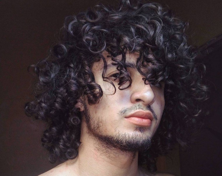 long hair man cutting curly hair