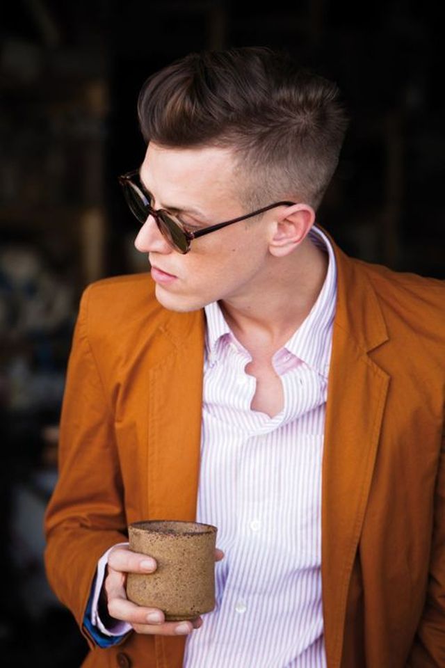 stylish man haircut orange jacket