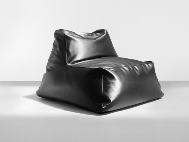 floor cushion as luxury gloss leather armchair