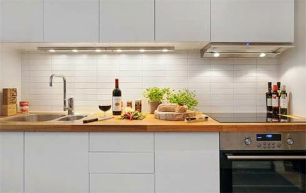 white kitchen with wooden counter