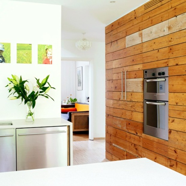 white kitchen and wood accent greenery