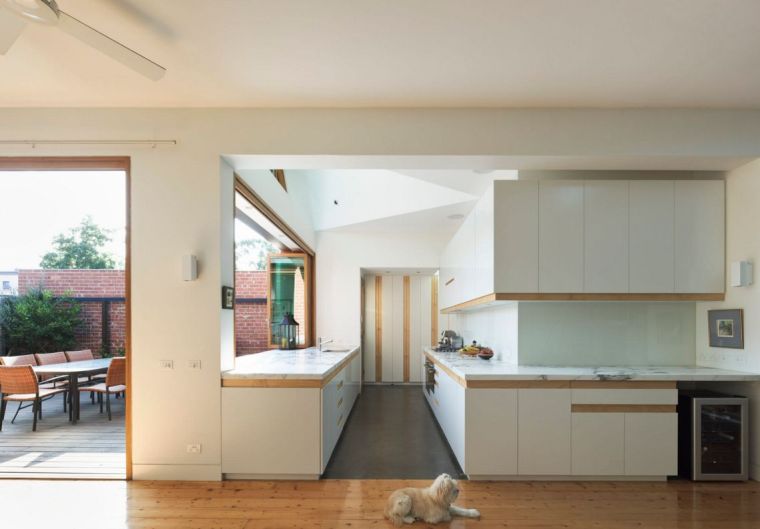 white kitchen and wood floor covering