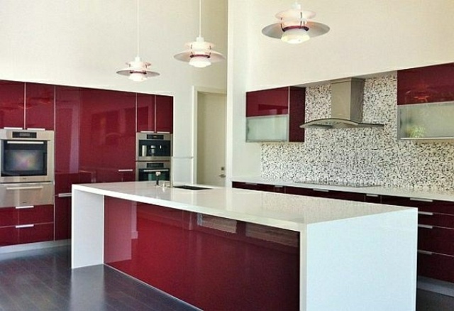 kitchen in red and white open central island preparation sink