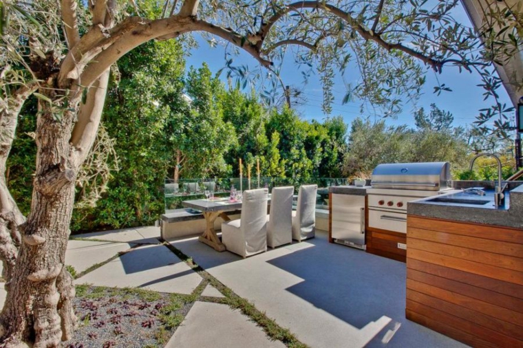 outdoor kitchen surrounded trees by Eva Knoppel