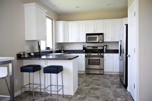 Modern-kitchen-original-idea-black-white-cupboards-stool bar