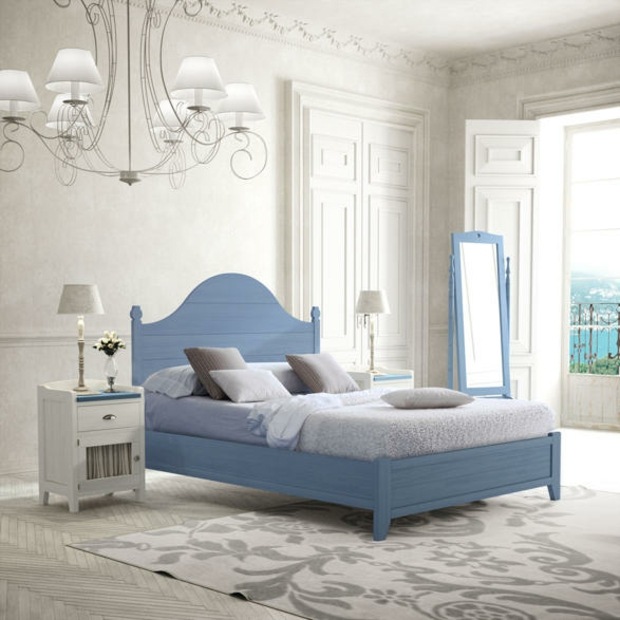 white decor punctuated by blue bed