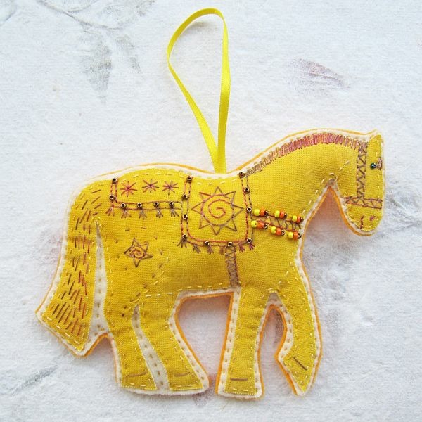 christmas decoration in yellow with figurine