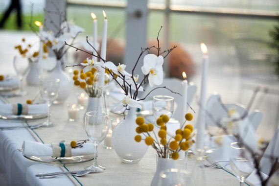 white table decoration yellow flowers orchids white