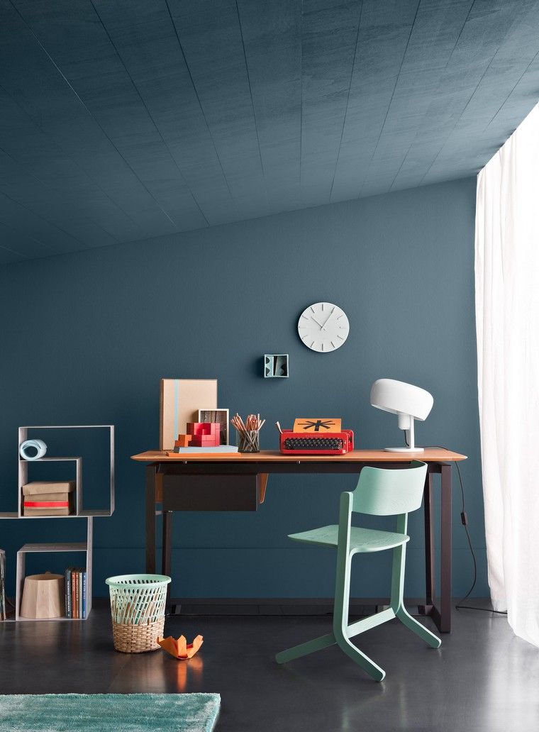 blue idea space work desk wood wall painting blue chair blue carpet