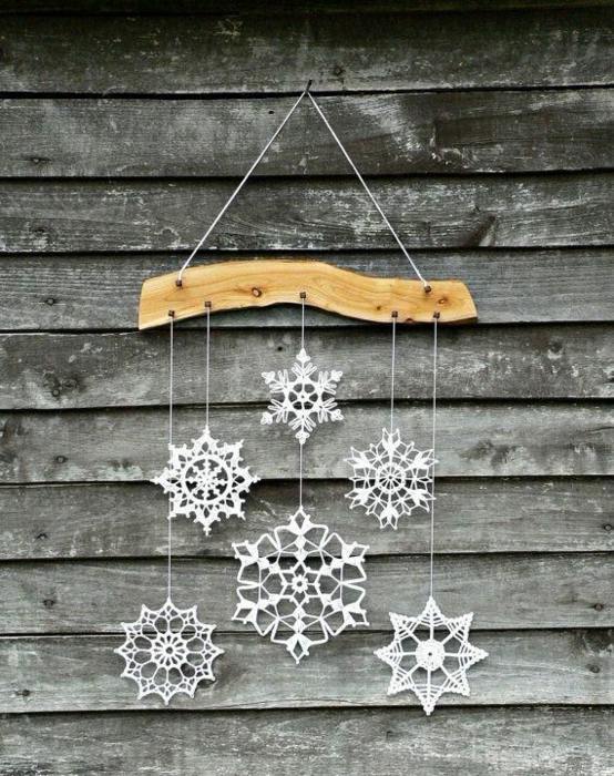 Winter decoration with homemade crochet snowflakes