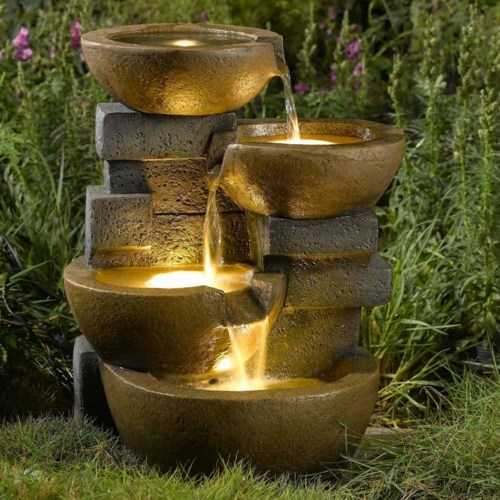 electric fountain illuminated garden plants brown green sculpture-vessel