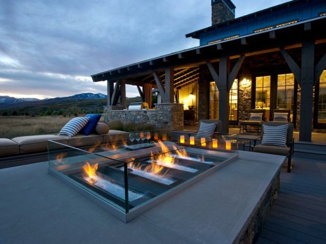 outdoor fireplace glass terrace home evening