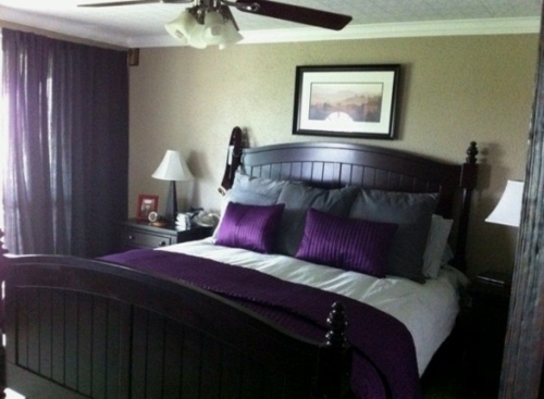 large black wood bed purple accents