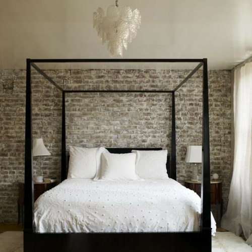 big black bed wall bricks