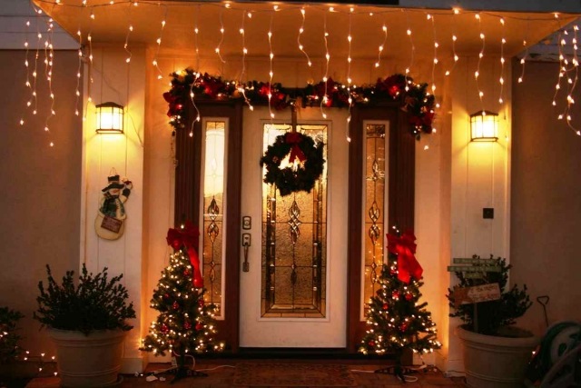 garlands-lights-Christmas-door-entry-little-fir-ribbons-red light garlands