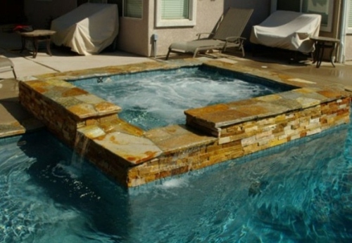 outdoor pool jacuzzi blue water square edge stone