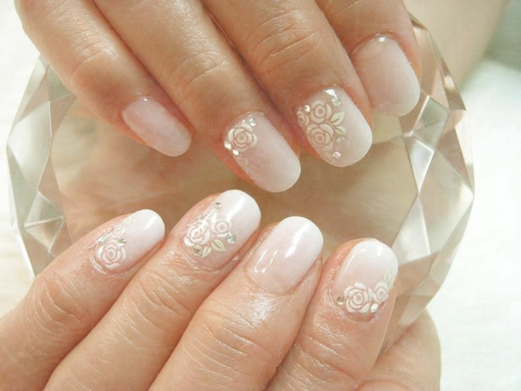 Wedding manicure white color patterns pink small glasses imitating diamonds