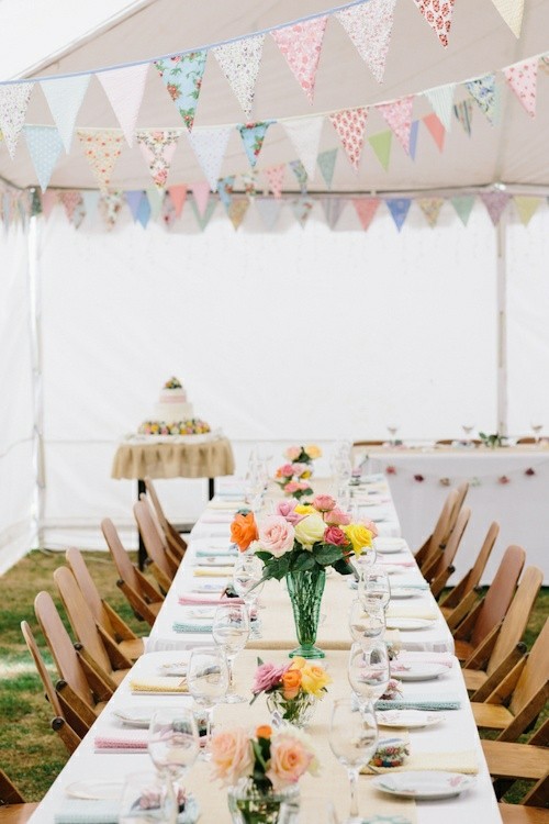 wedding under tent wooden chairs