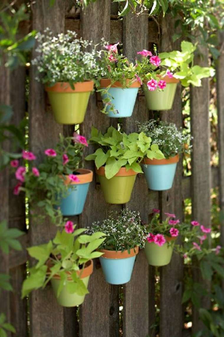 mini flower pots on fence