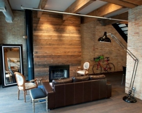 wood wall sofa brown fireplace living room male