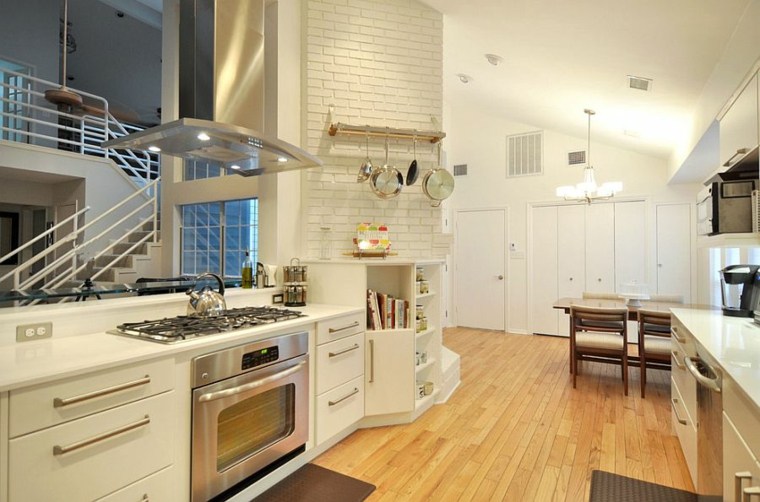 brick wall exposed white kitchen