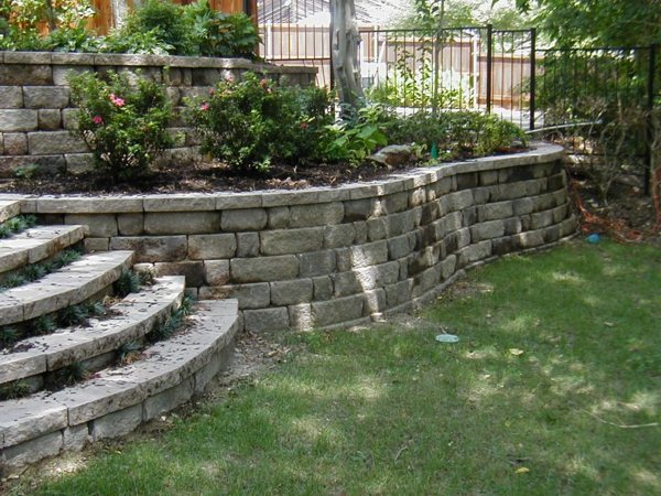 stone wall metal fence