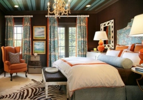 dark walls carpet zebra armchair orange bedroom