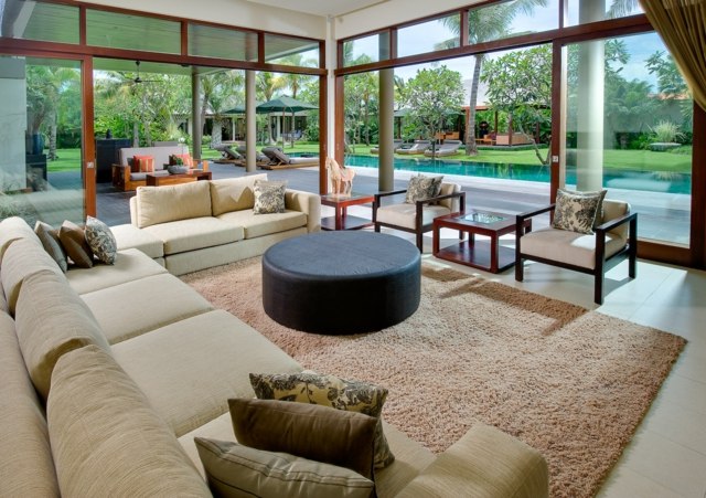 glass walls living room pool view