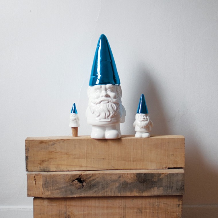 garden gnomes of different size white hat blue