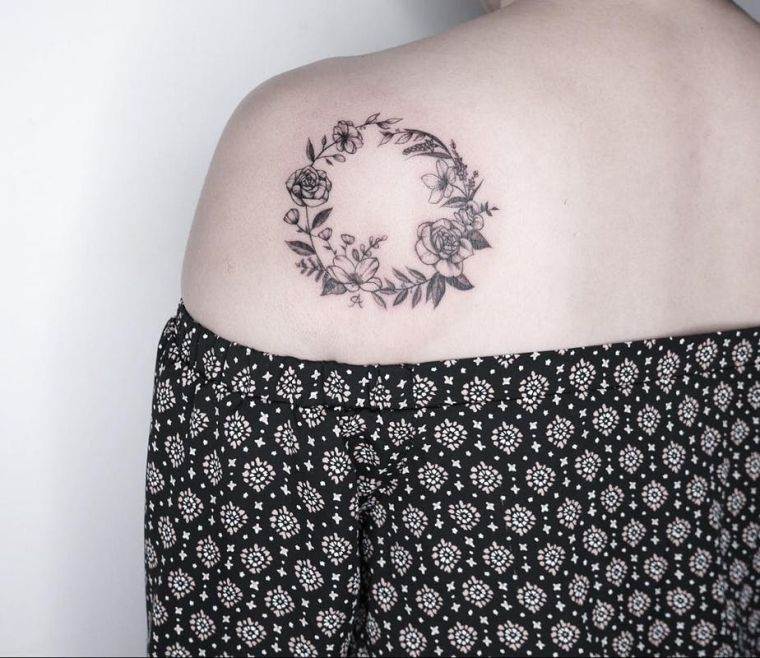 small tattoo woman-shoulder-crown-flowers