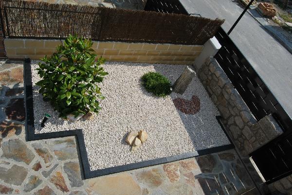 small garden of gravel in patio