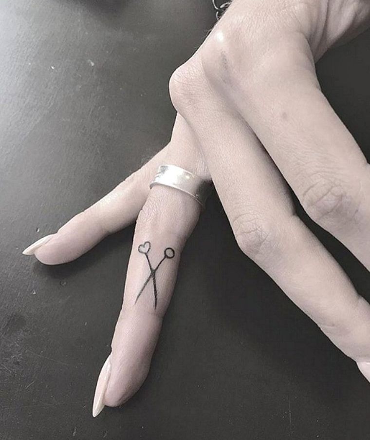 small discreet tattoo-finger-woman