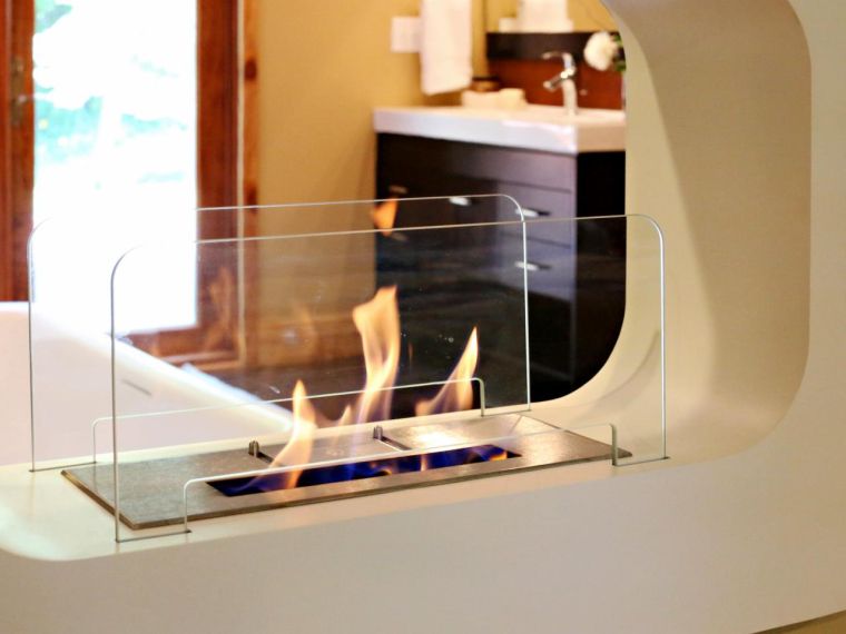 small glass fireplace contemporary bathroom