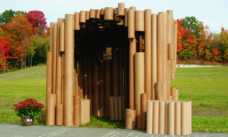 small-house-child outside and cardboard