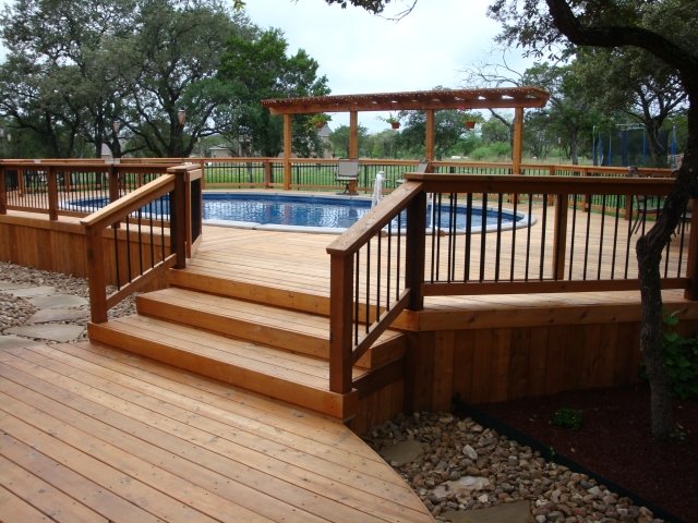 pool-out-ground-wood large pergola-wood-decorative fence